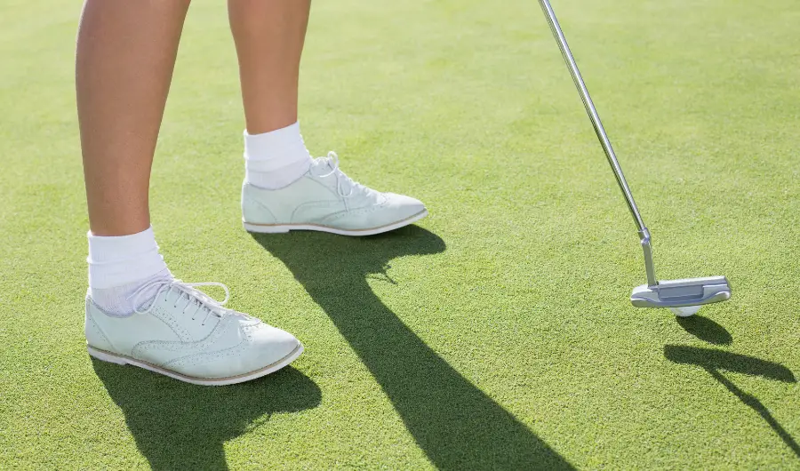 White spiked golf shoes